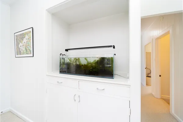 a picture of a bathroom with a shower and a mirror