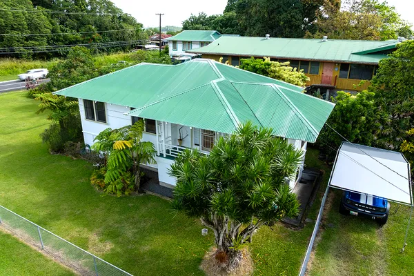 an aerial view of a house with swimming pool garden and patio