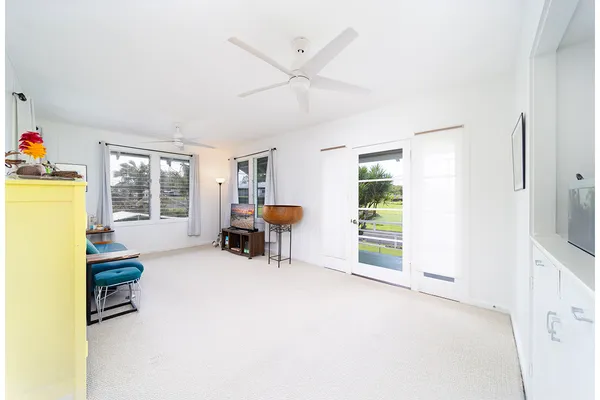 a view of a livingroom with furniture and a window