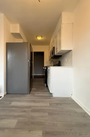 a view of a kitchen with a sink