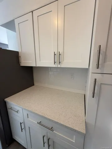 a view of cabinets and a wooden floor