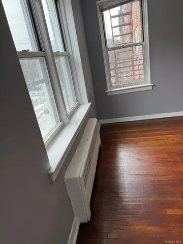 a view of an entryway with wooden floor