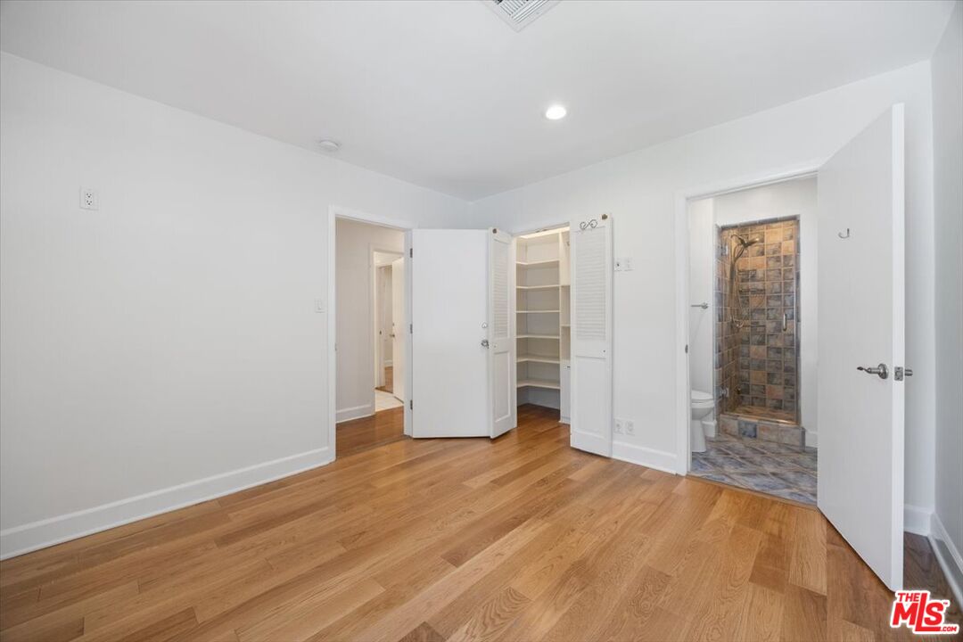 14041 Roblar Road Sherman Oaks, CA 91423 - Photo 27 of 47 a view of empty room with wooden floor