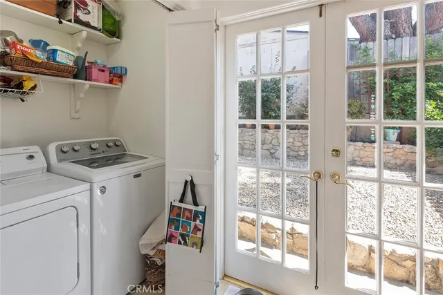 a view of storage and utility room with washer and dryer