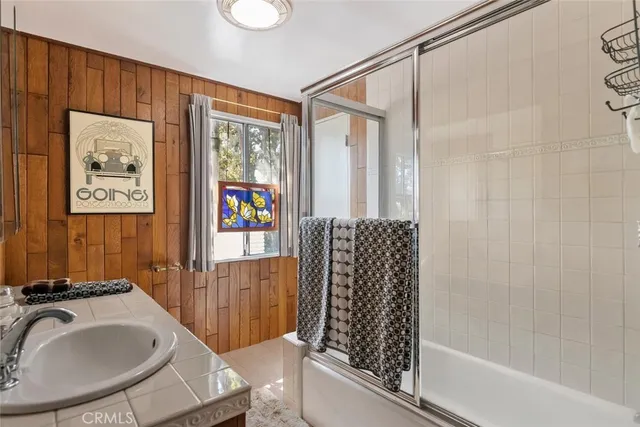 a view of a hallway with workspace and window