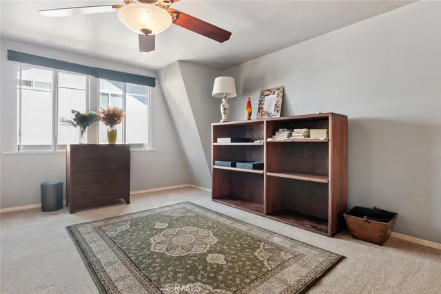 a view of a hallway with workspace and entryway