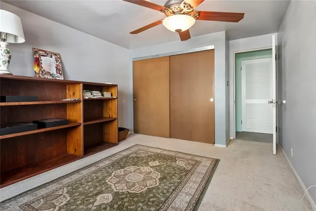 a bedroom with a bed dresser and a window