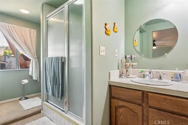 a bathroom with a double vanity sink and a mirror