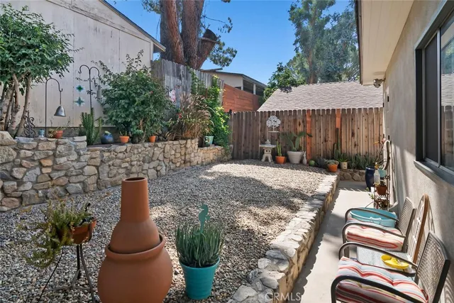 an outdoor space with furniture and umbrella
