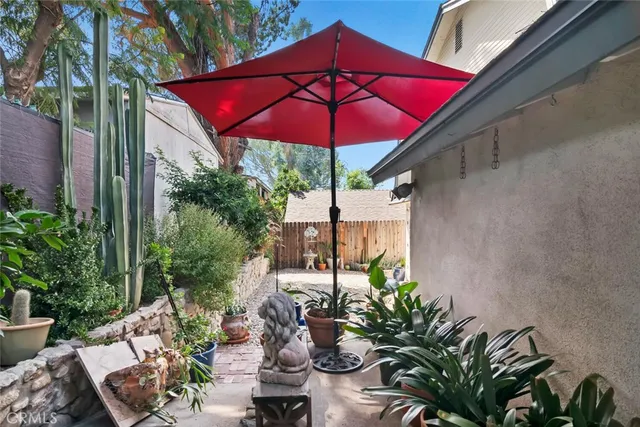 a view of a backyard with sitting area