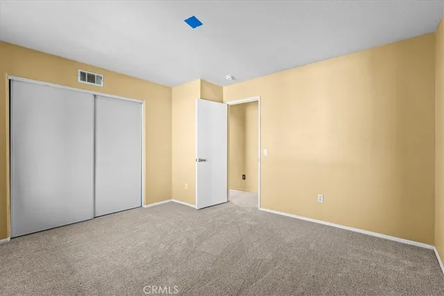 an empty room with a empty space and windows