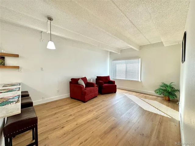 a room with furniture and wooden floor