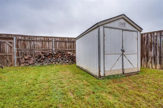 a view of a backyard with a small cabin