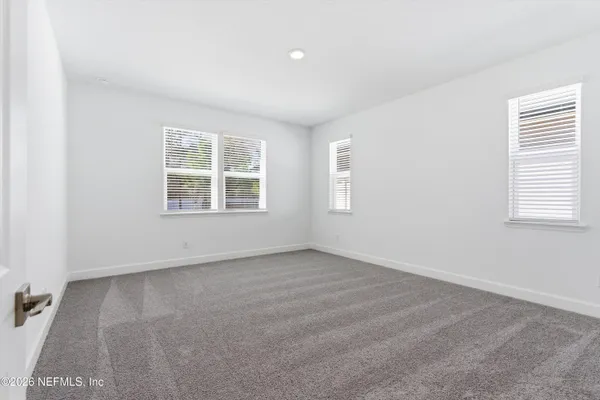 an empty room with windows