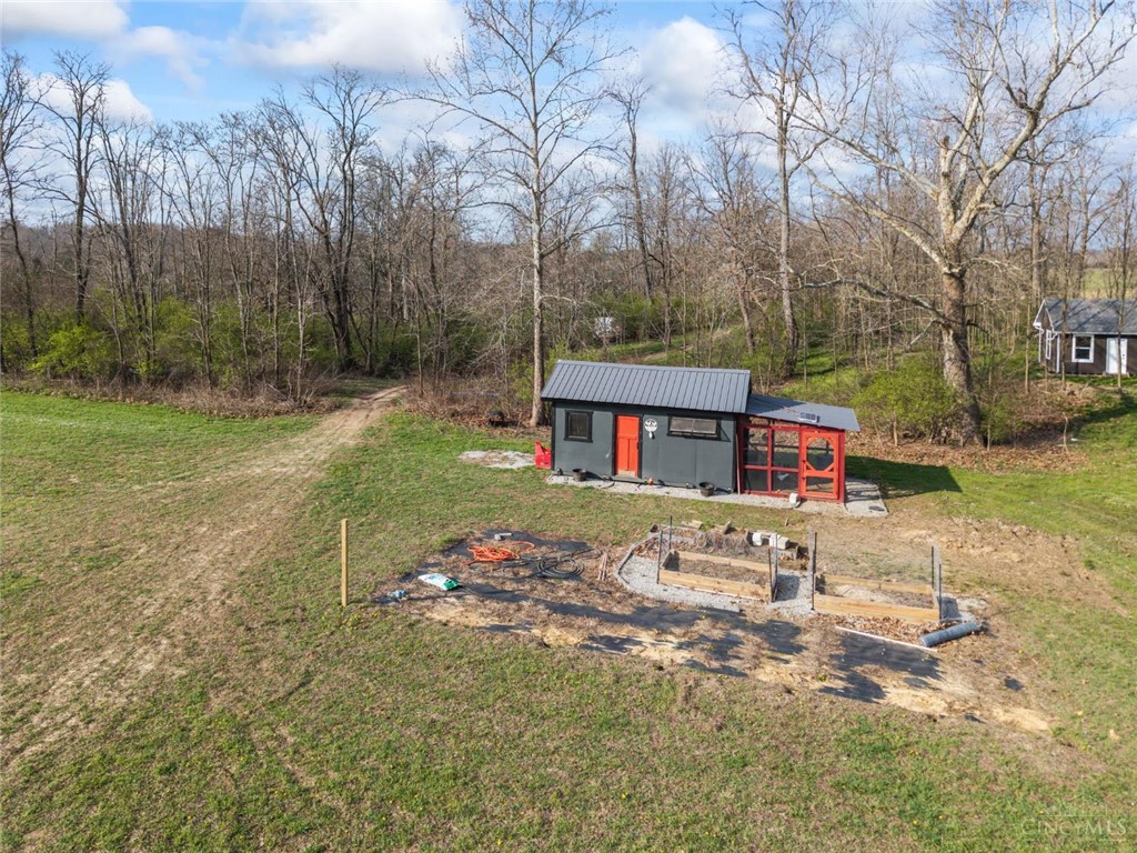 2425 Middleboro Road Clarksville, OH 45113 - Photo 13 of 91 This charming structure offers a serene setting amidst expansive grounds and lush natural surroundings.