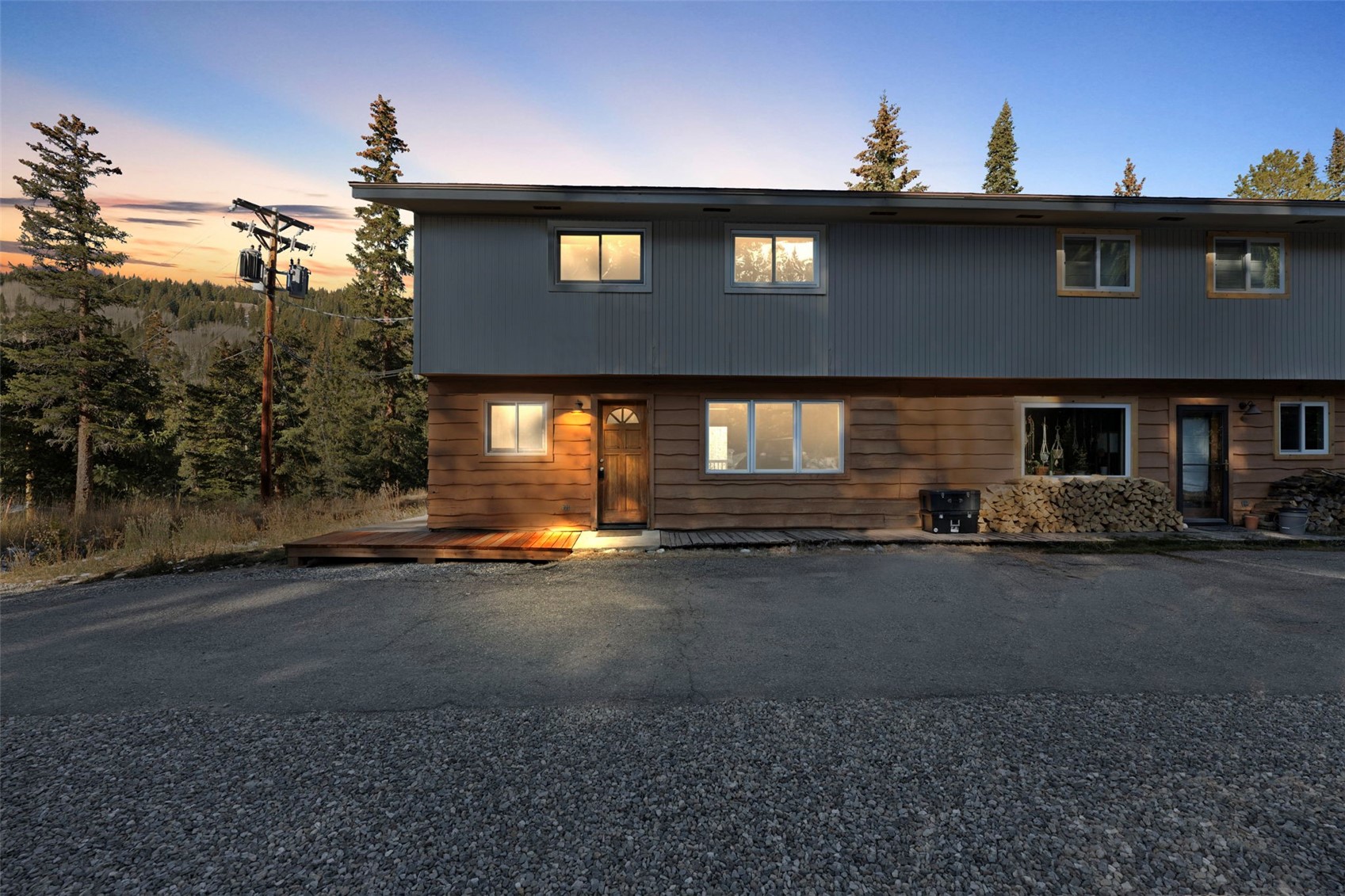 283 Range Road, Unit 1 Breckenridge, CO 80424 - Photo 1 of 11 The lighted windows are the condo for sale. Ground floor has kitchen, open living area, bathroom and washer and dryer.