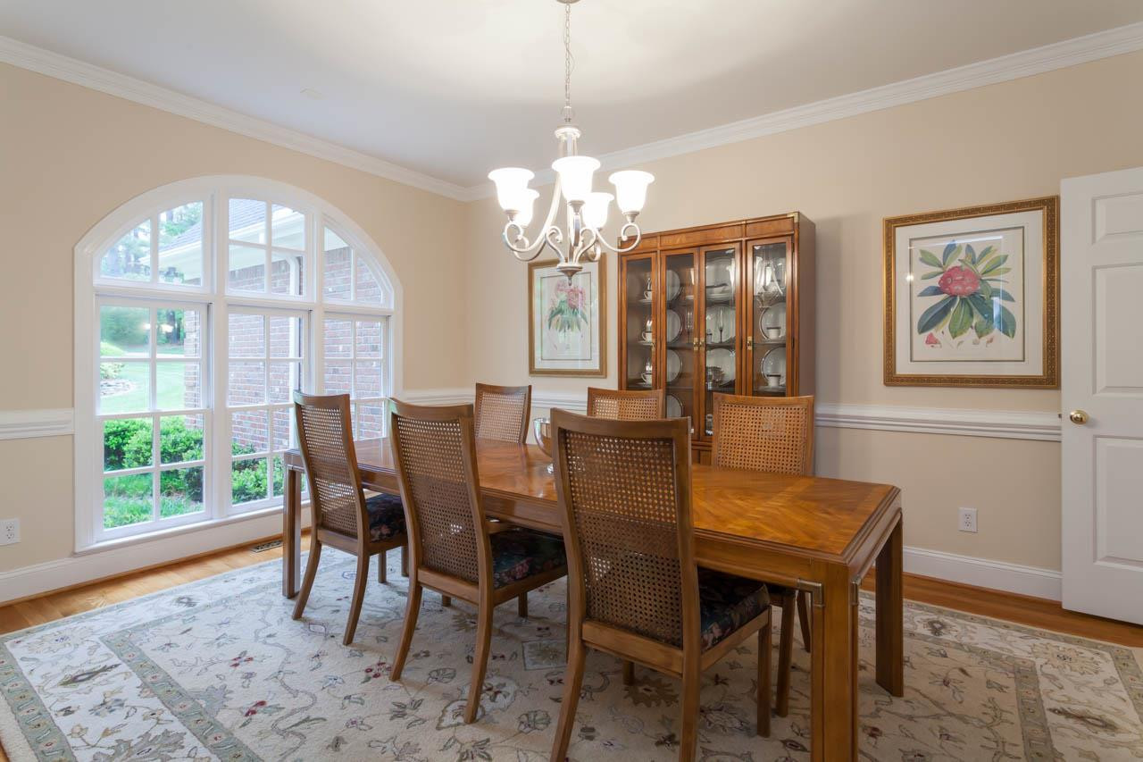 13921 Possum Track Road Raleigh, NC 27614 - Photo 9 of 25 Dining Room is also adorned with a beautiful Palladium window, chair and crown moldings and glowing hardwoods. Dining Room