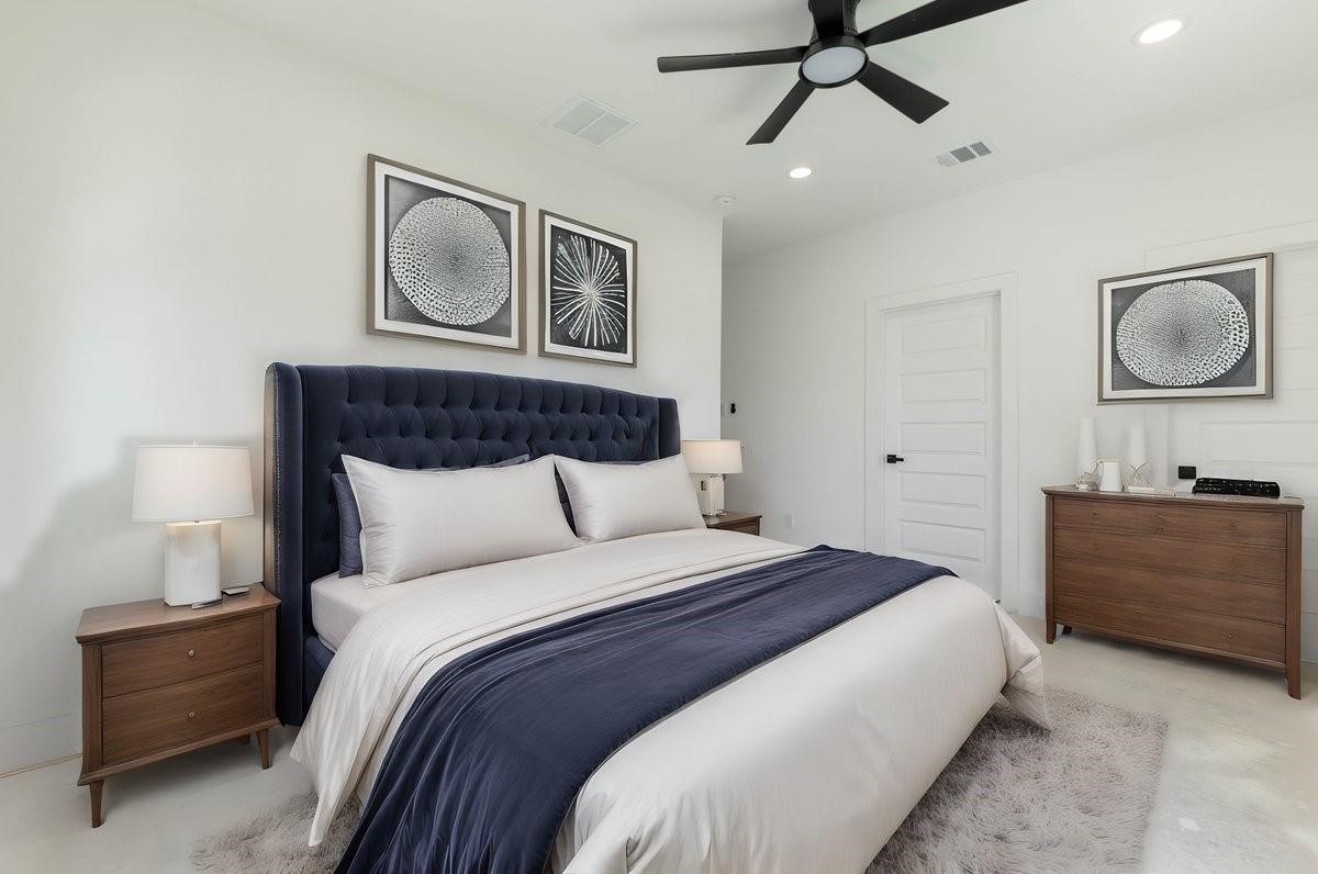 408 Armstrong Street, Unit B Houston, TX 77029 - Photo 6 of 14 a bedroom with a bed and cabinet