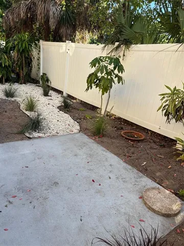 a view of a backyard of the house