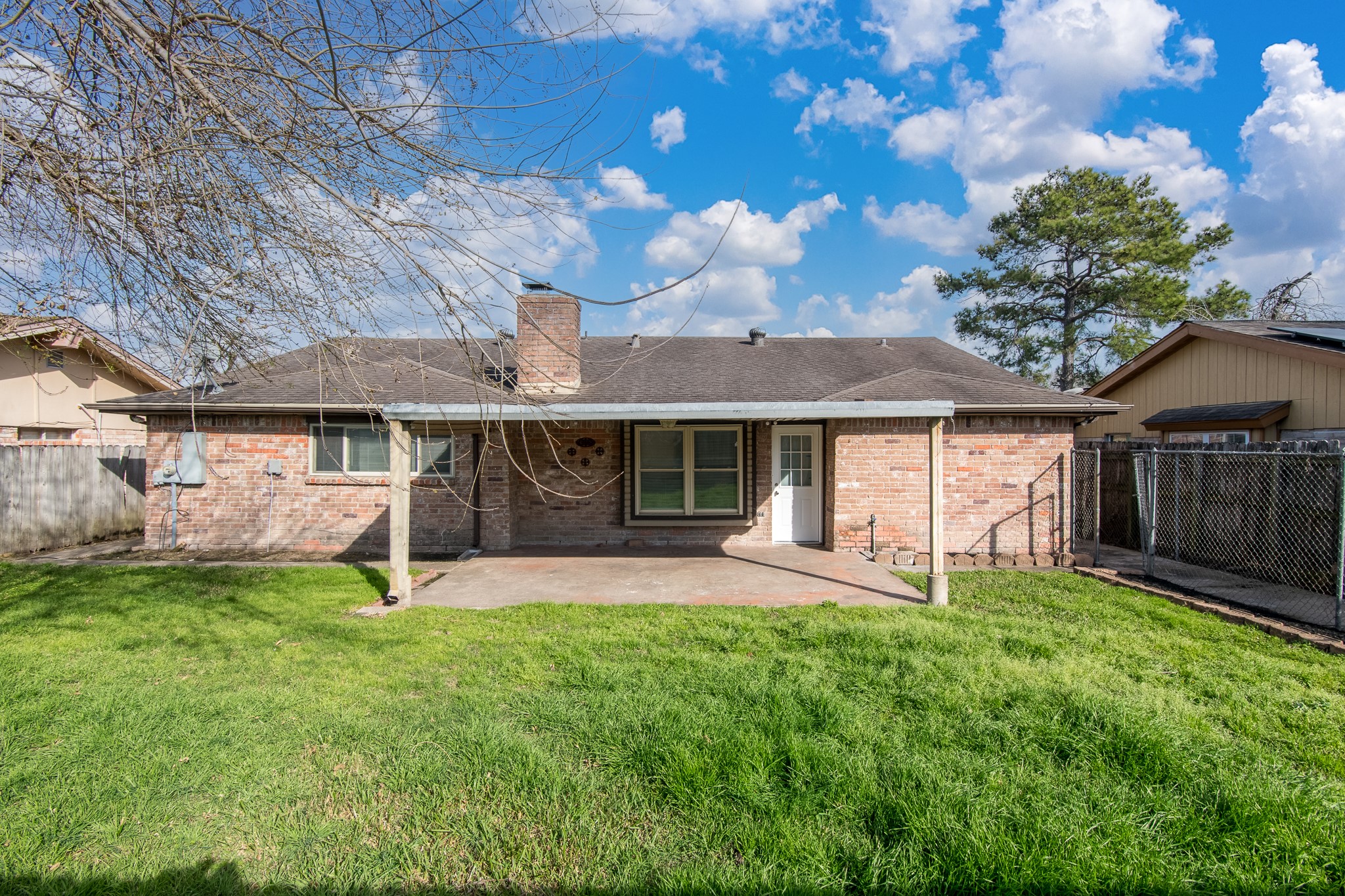 9707 Whitepost Lane Houston, TX 77086 - Photo 19 of 30 a front view of a house with a yard and porch