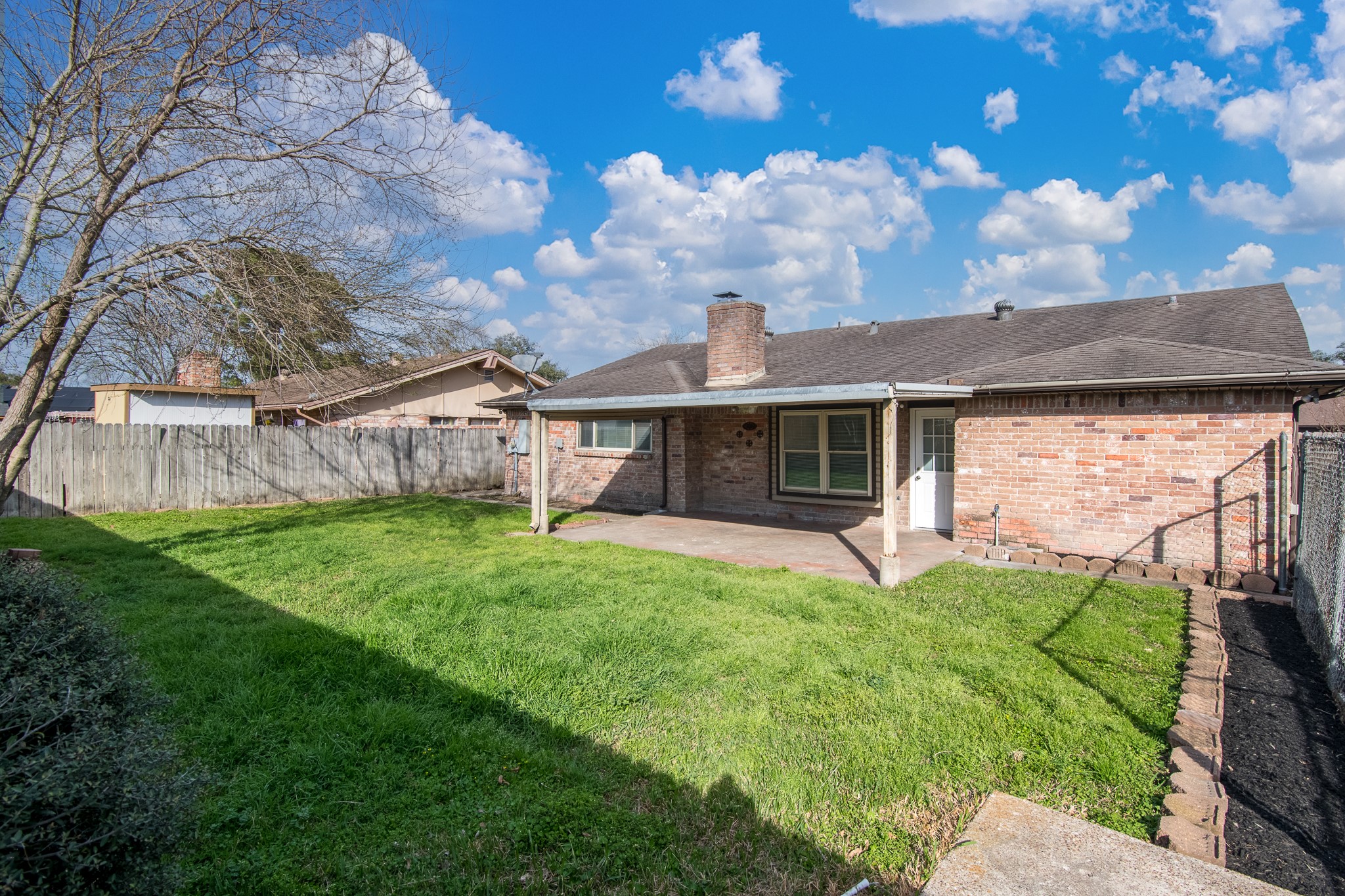 9707 Whitepost Lane Houston, TX 77086 - Photo 20 of 30 a view of a house with a yard and sitting area