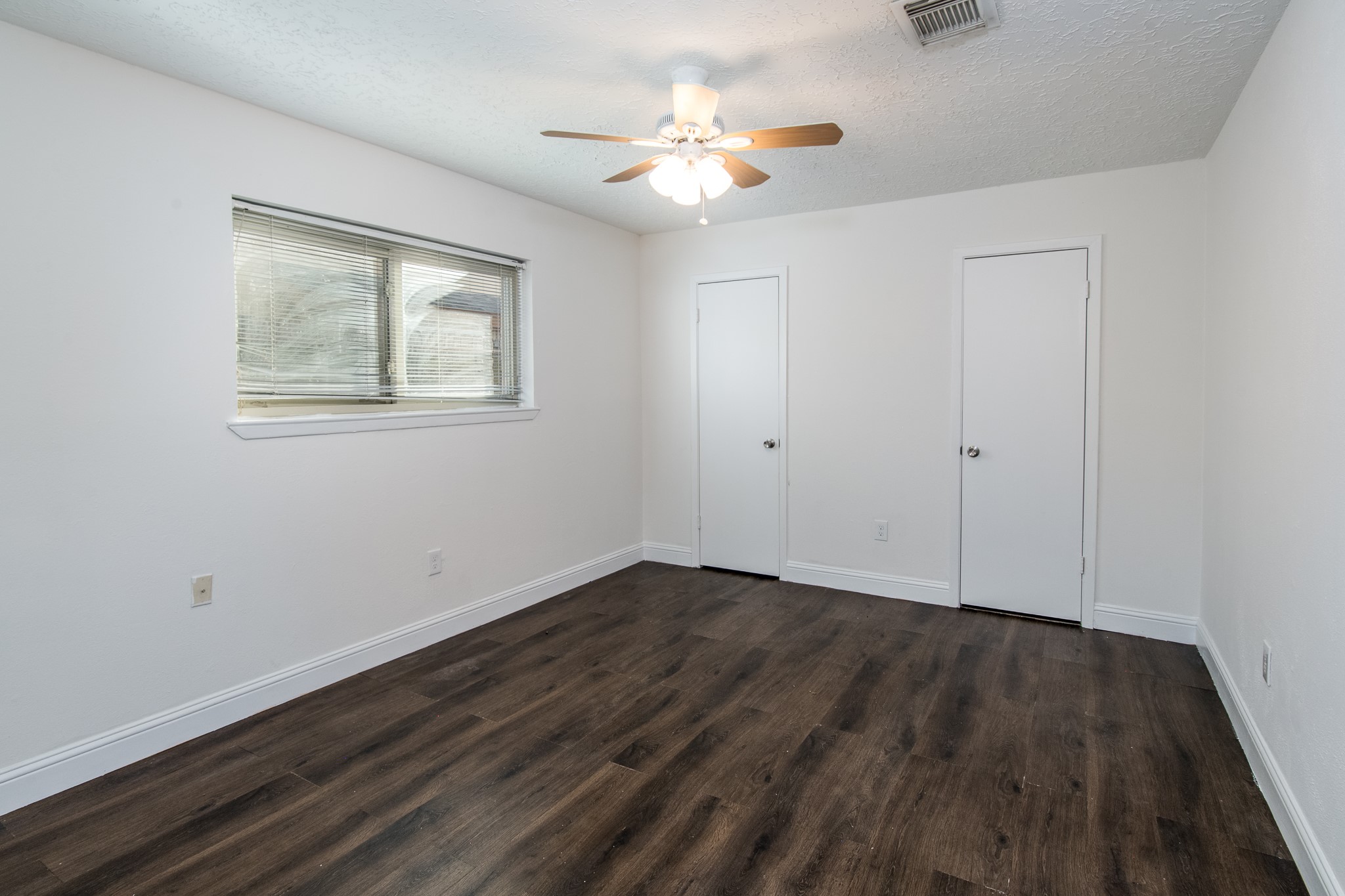 9707 Whitepost Lane Houston, TX 77086 - Photo 28 of 30 wooden floor in an empty room with a window