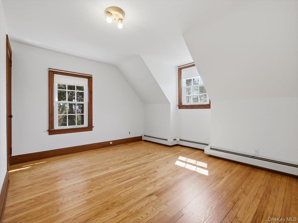 311 Gate Hill Coop Road Stony Point, NY 10980 - Photo 29 of 42 This room features warm-toned hardwood floors, white walls, and two windows with wooden frames