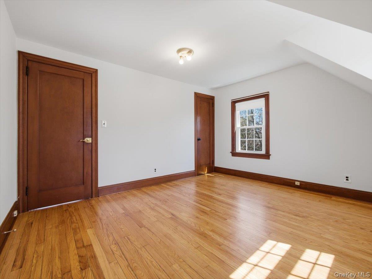 311 Gate Hill Coop Road Stony Point, NY 10980 - Photo 30 of 42 This room features hardwood floors, white walls, and a window with wood trim