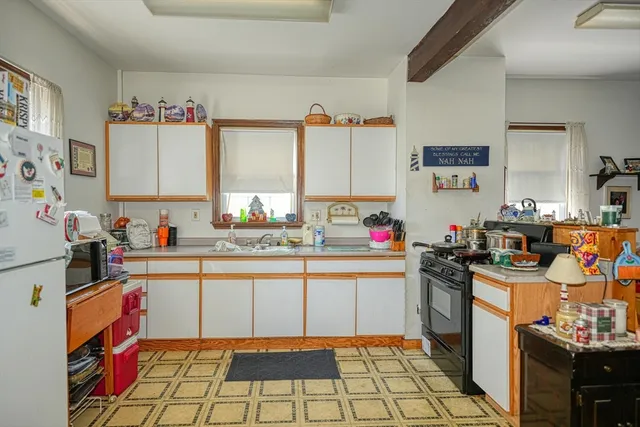 a bed room with a bed and a chair