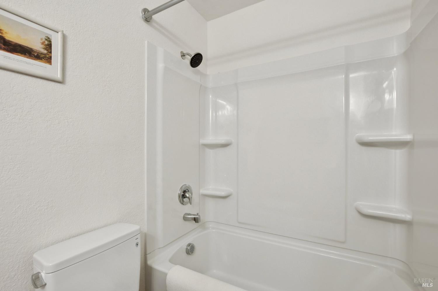 1801 Marshall Road, Unit 401 Vacaville, CA 95687 - Photo 13 of 20 a bath room with a toilet and a bath tub