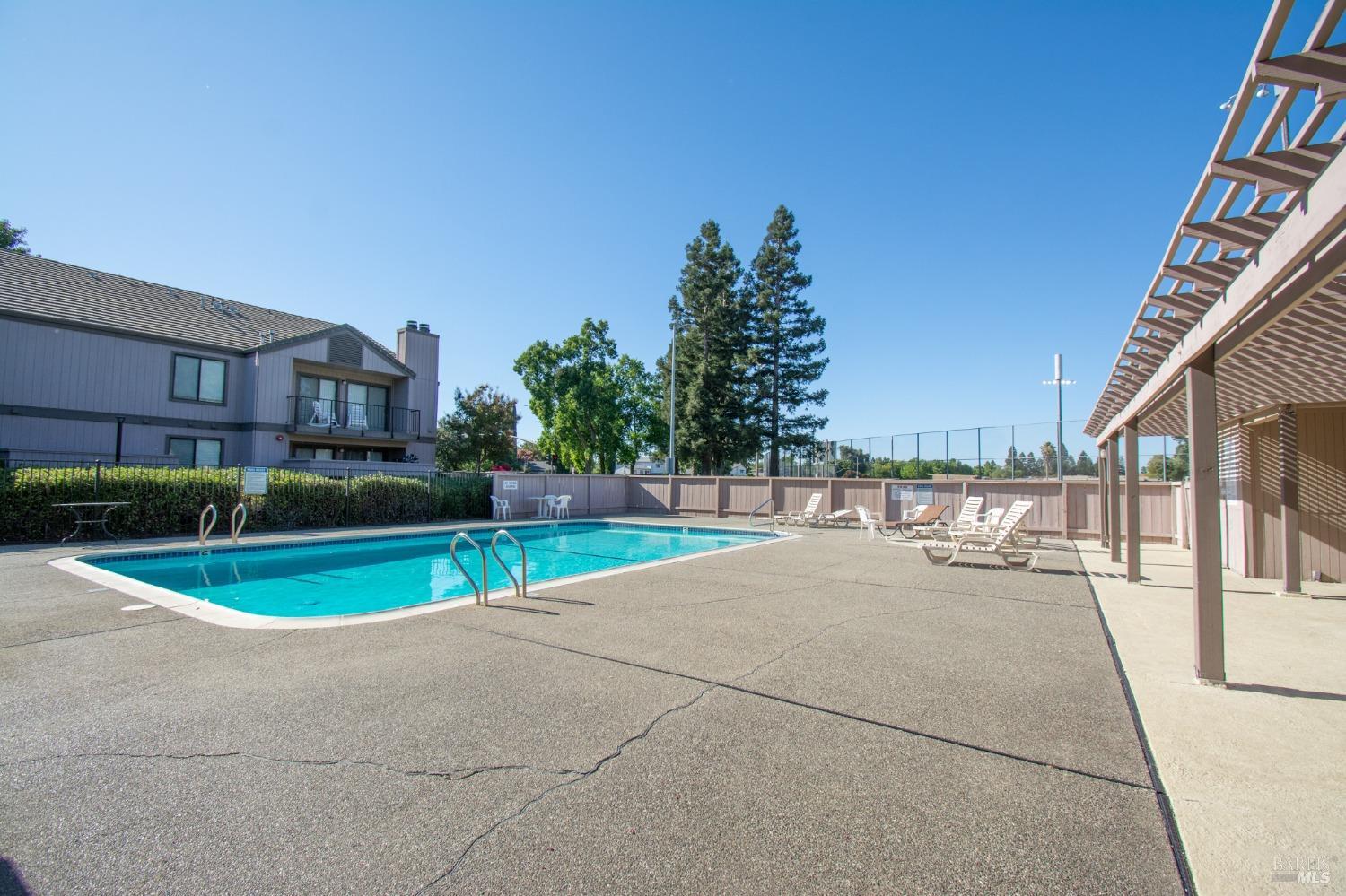 1801 Marshall Road, Unit 401 Vacaville, CA 95687 - Photo 18 of 20 a view of swimming pool in front of residential houses