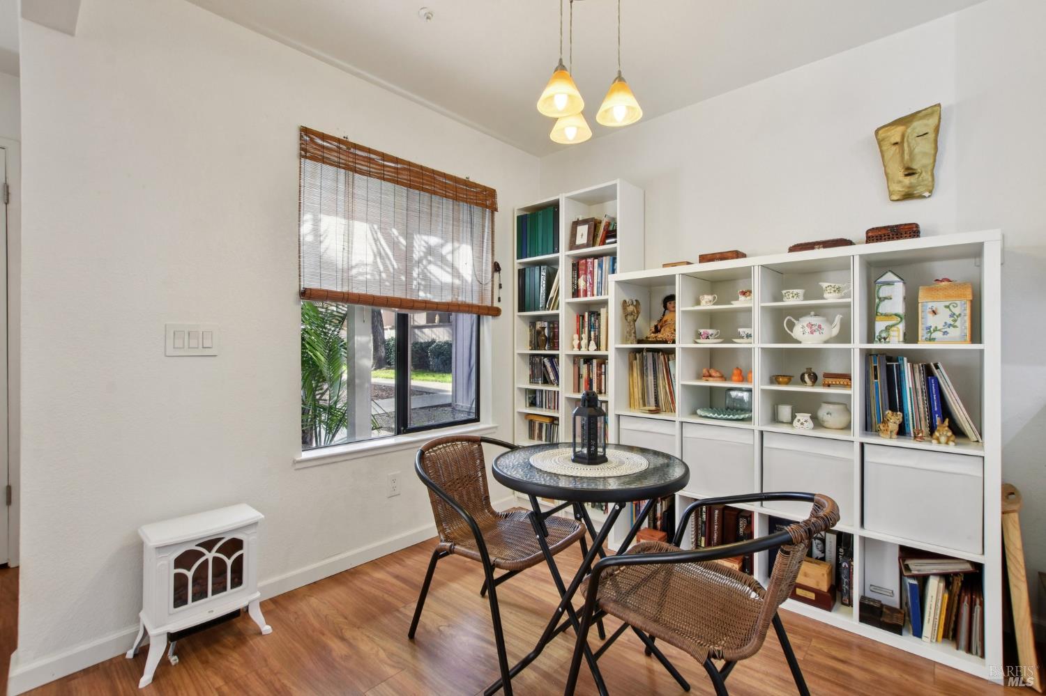 1801 Marshall Road, Unit 401 Vacaville, CA 95687 - Photo 6 of 20 a view of a dining room with furniture large window and wooden floor