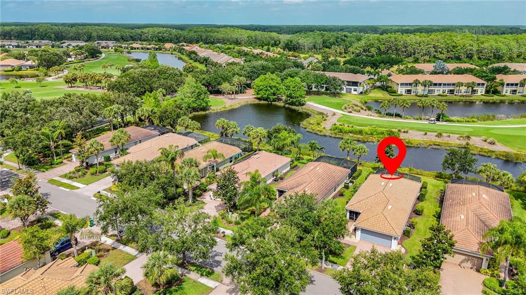5801 Declaration Court Ave Maria, FL 34142 - Photo 28 of 38 an aerial view of residential house with outdoor space and lake view