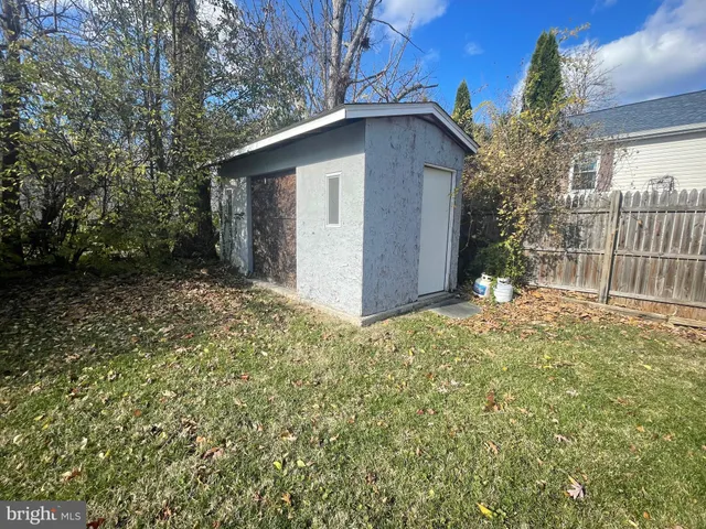 a house view with a sitting space and garden