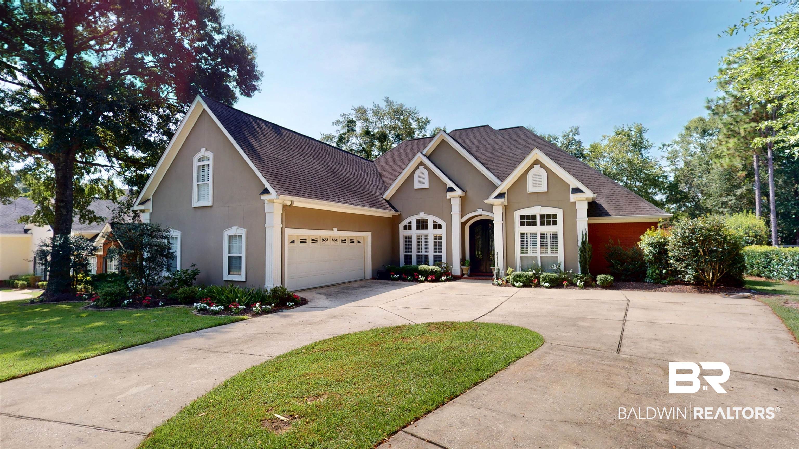 8775 Dawes Lake Road North Mobile, AL 36619 - Photo 2 of 59 Traditional home with roof with shingles, a front lawn, and stucco siding