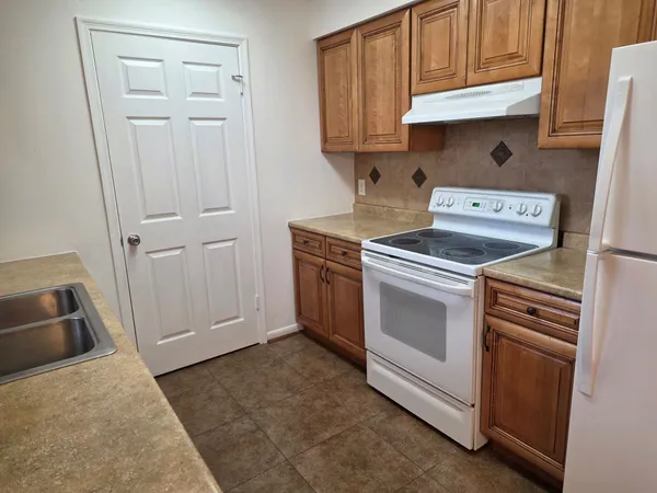 a kitchen with a stove and a sink