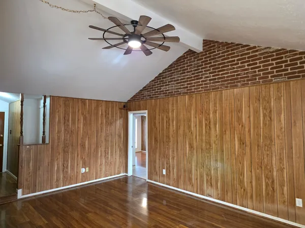 a view of a livingroom with wooden floor