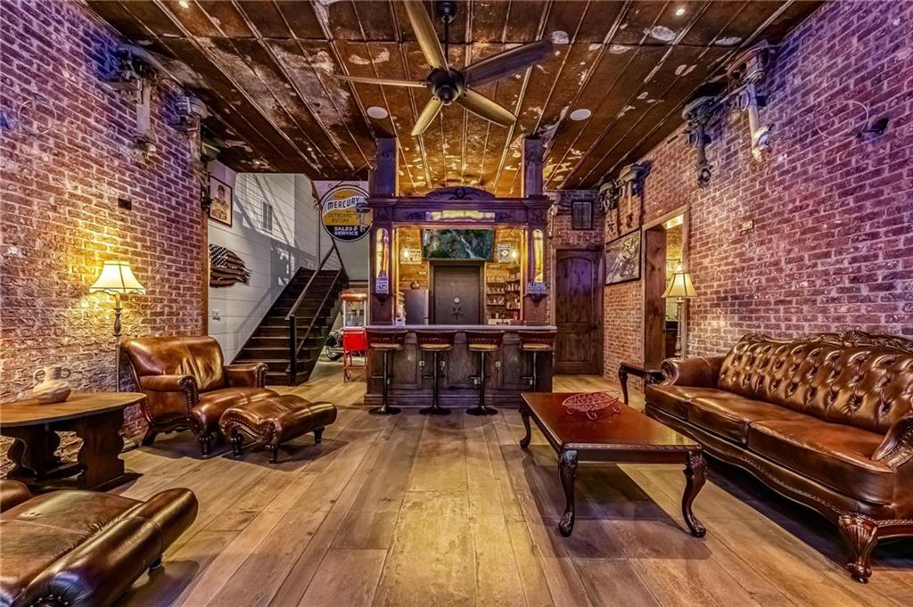 66 Rome Point Blue Ridge, GA 30513 - Photo 25 of 59 a view of a patio with table and chairs with wooden floor and fence