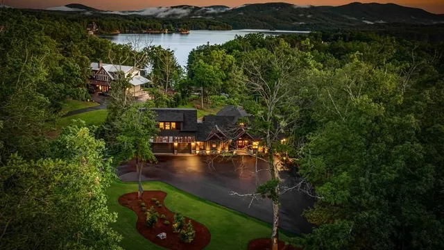 a aerial view of a house with a lake view