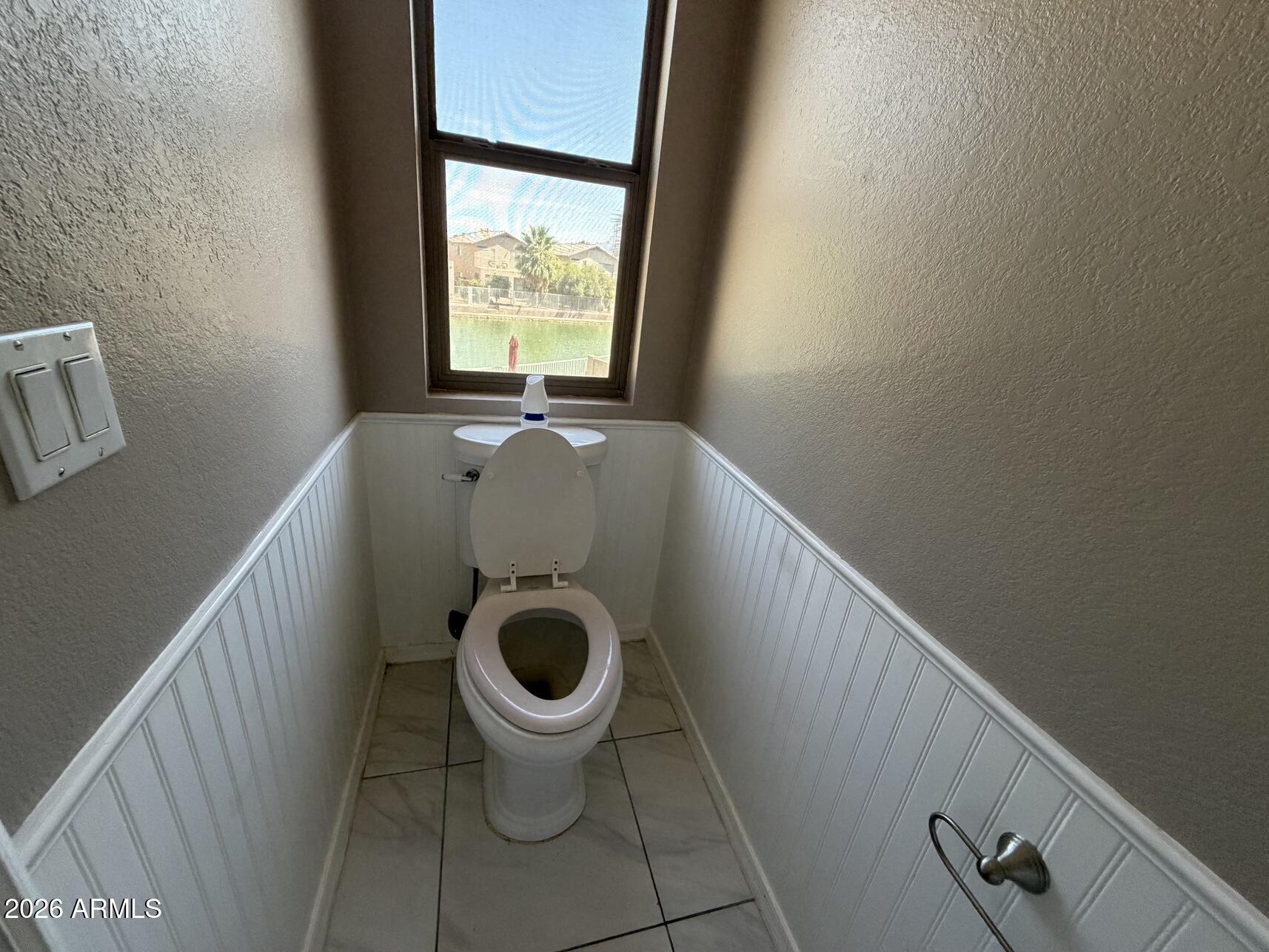 10807 West Monte Vista Road Avondale, AZ 85392 - Photo 32 of 33 a bath room with a sink and a toilet