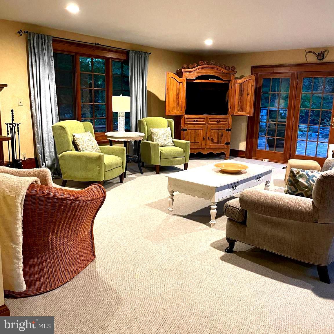811 Upper Glencoe Road Sparks Glencoe, MD 21152 - Photo 21 of 36 a living room with furniture fireplace and flat screen tv