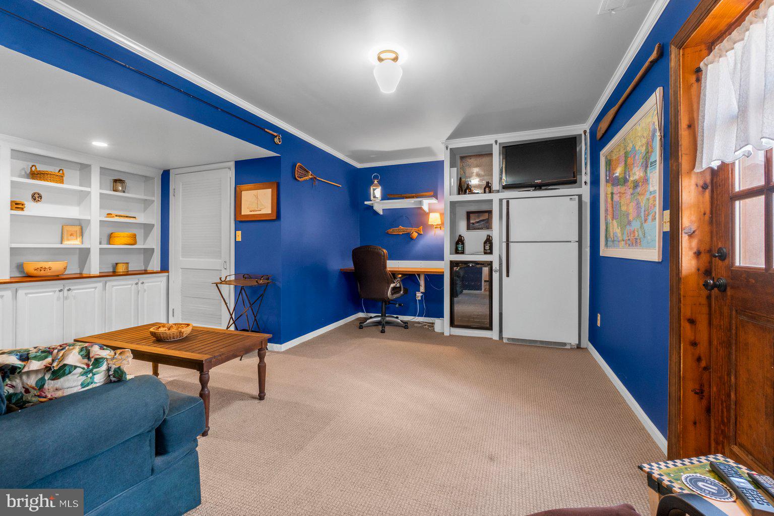 811 Upper Glencoe Road Sparks Glencoe, MD 21152 - Photo 7 of 36 a room with furniture and a book shelf