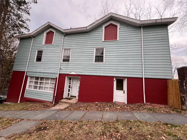 a front view of a house with garage