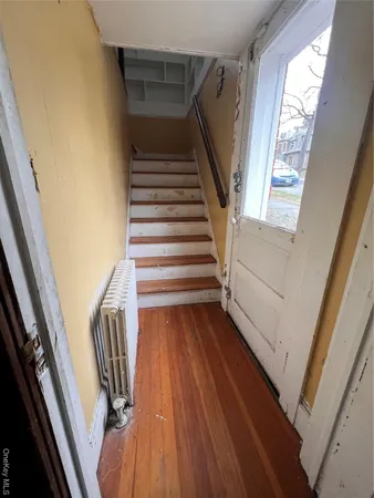 a view of stairs and with wooden floor