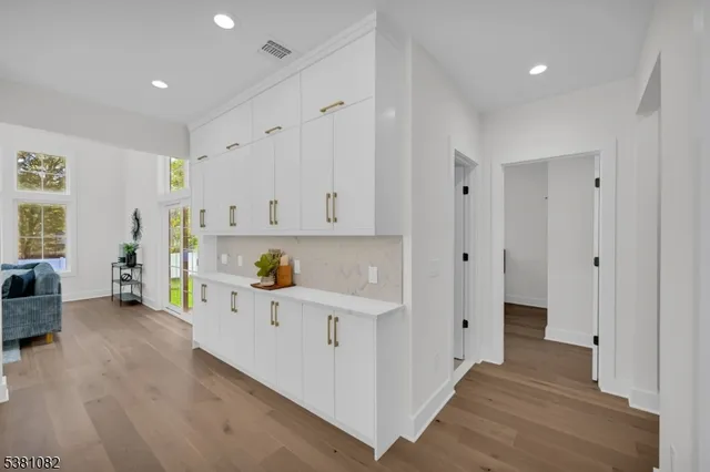 a kitchen with stainless steel appliances a refrigerator and a stove top oven
