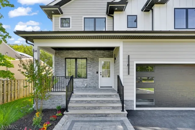 a front view of a house with a porch
