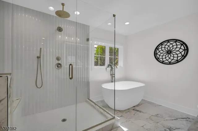 a bathroom with a sink a mirror and a shower