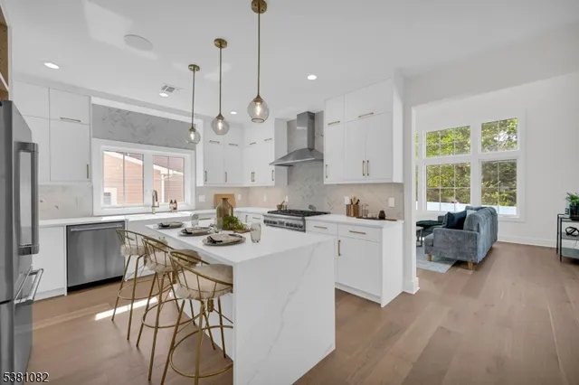 a kitchen with a table chairs stove and microwave