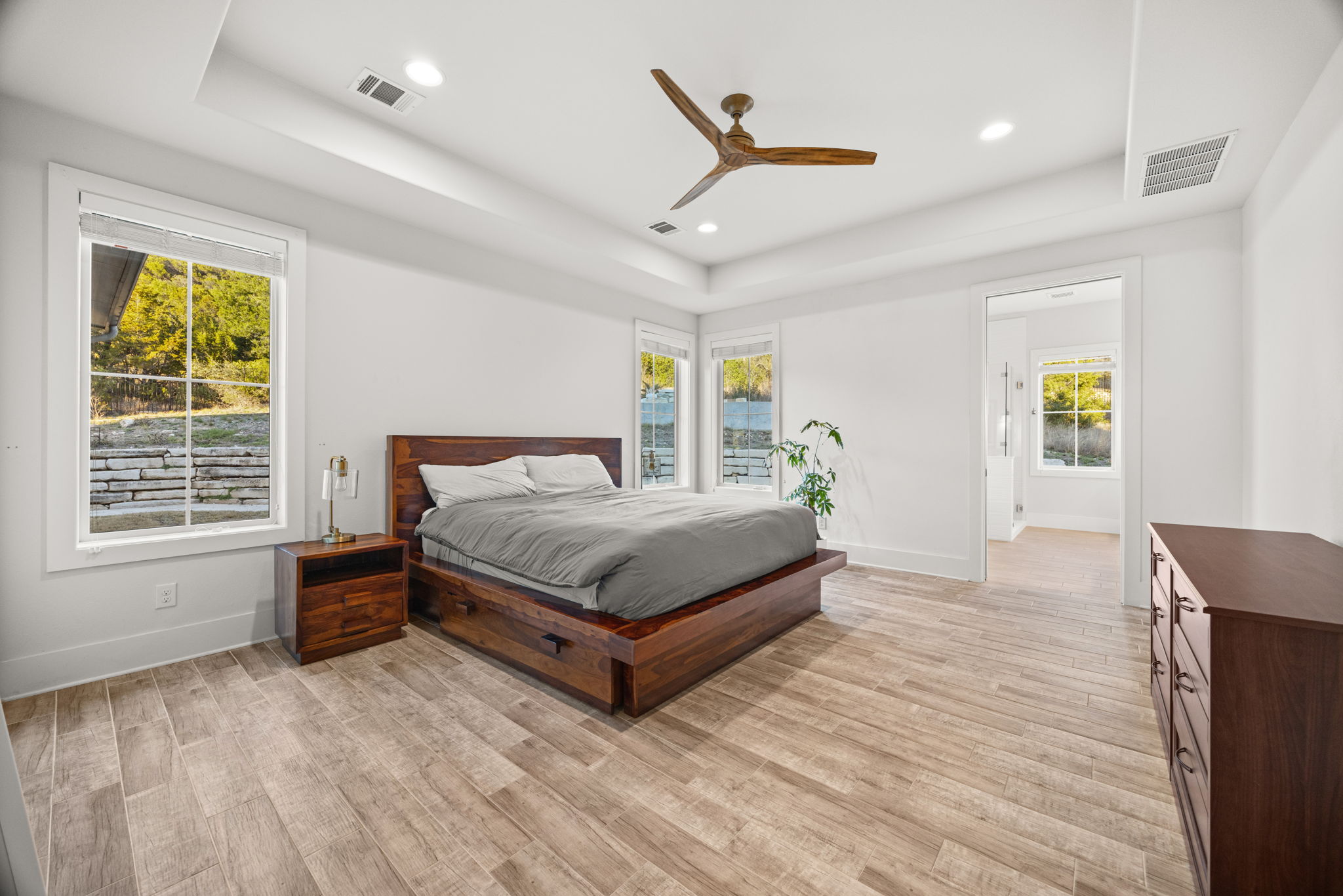 7809 Brandy Way Volente, TX 78641 - Photo 13 of 40 a bedroom with a bed and window