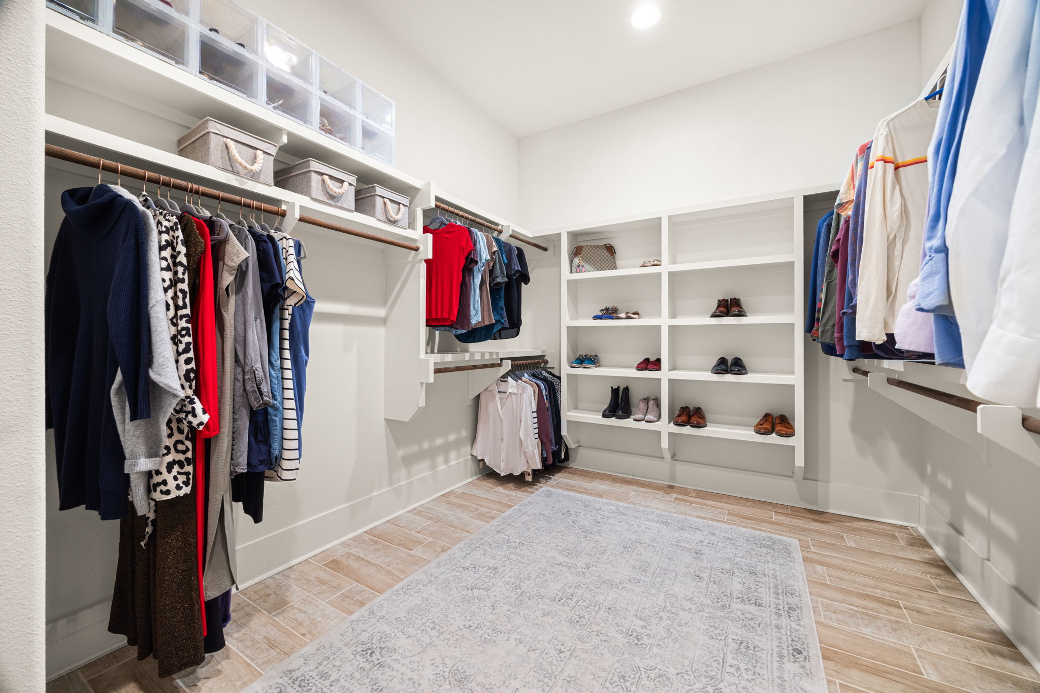 7809 Brandy Way Volente, TX 78641 - Photo 17 of 40 a view of walk in closet with clothes and shoes